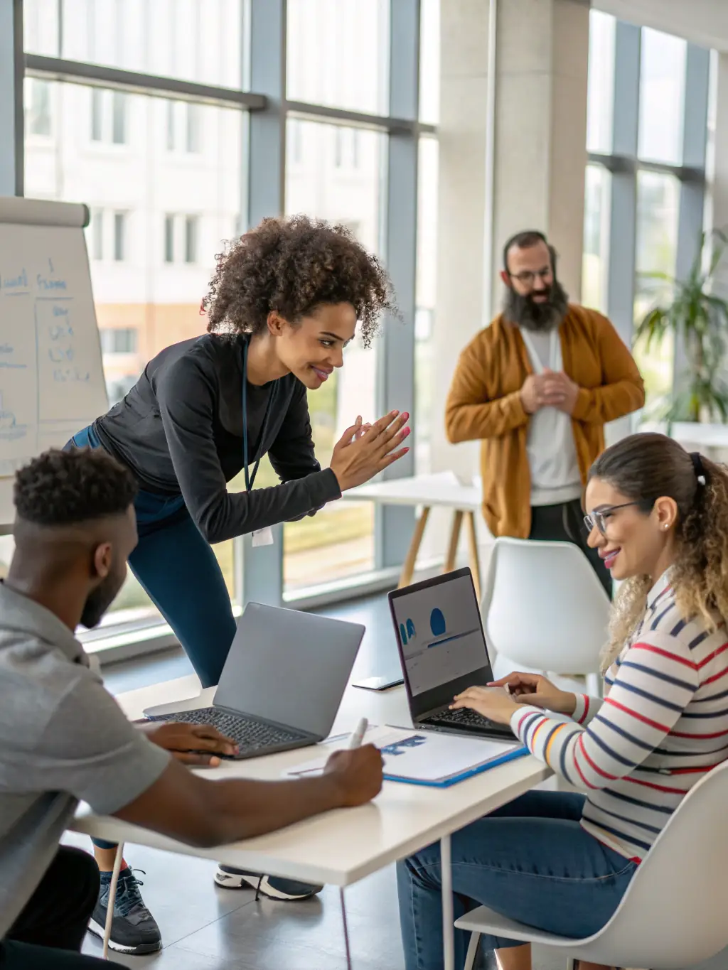 An image showing a group of professionals participating in a cybersecurity training session, with an instructor leading the discussion.